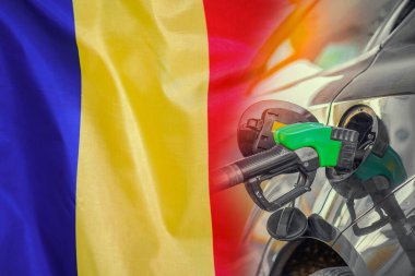 Car with a fuel injector on Moldavia flag background. Record prices fuel for population. Gasoline price increase during energy and fuel world crisis in Moldavia