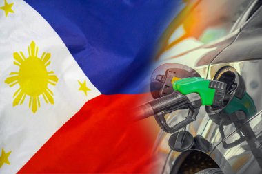 Car with a fuel injector on Philippines flag background. Record prices fuel for population. Gasoline price increase during energy and fuel world crisis in Philippines