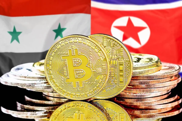 Bitcoins on flag Syria and North Korea background. Concept for investors in cryptocurrency and Blockchain technology in Syria and North Korea