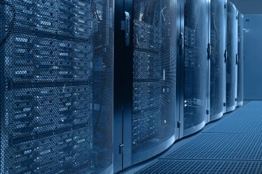 Working data center. Centers data center with multiple rows. Data center in server room with server racks. Concept cloud computing, artificial intelligence, supercomputer, cybersecurity