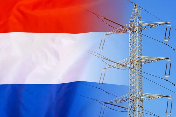Netherlands flag on electric pole background. Power shortage and increased energy consumption in Netherlands. Energy crisis in Netherlands