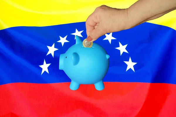 Hand Elderly Woman Putting Coin Piggy Bank Venezuela Flag Background — Stock Photo, Image