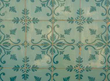 Green ceramic tiles from facade of old houses in Lisbon Portugal. Portuguese traditional Azulejos decorative artistic design background, creative texture surface.