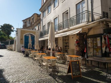 Lisbon, Portugal, October 24, 2021: View of Lisbon street leading to Castelo de sao Jorge at medieval quarter Alfama