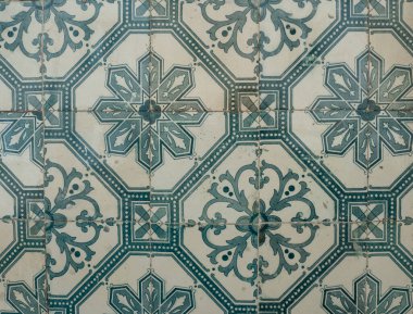 Green ceramic tiles from facade of old houses in Lisbon Portugal. Portuguese traditional Azulejos decorative artistic design background, creative texture surface.