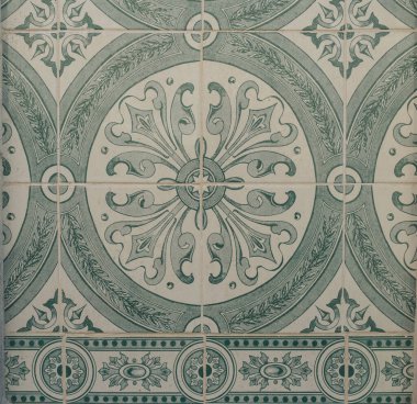 Green ceramic tiles from facade of old houses in Lisbon Portugal. Portuguese traditional Azulejos decorative artistic design background, creative texture surface.