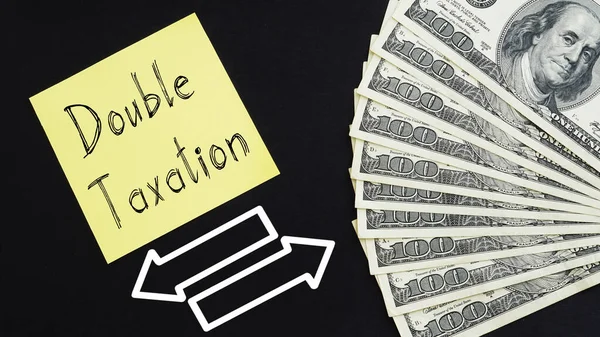 Çift Vergilendirme, dolarların bir metin ve fotoğrafı kullanılarak gösterilir