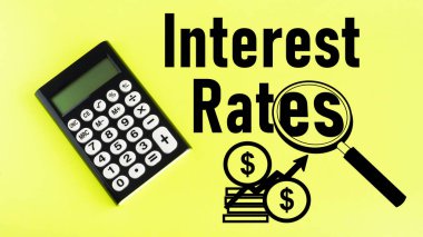 Faiz oranları bir metin ve büyüteç kullanılarak gösterilir