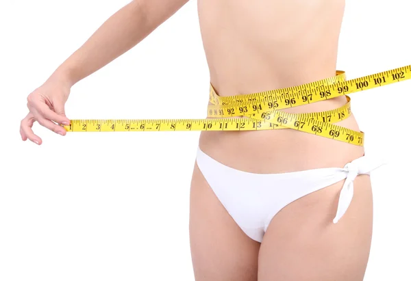 若い女性を白で隔離される腰を測定 — ストック写真