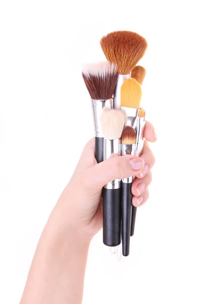 Borstels voor make-up in hand geïsoleerd op wit — Stockfoto