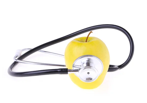 Stethoscope and yellow apple isolated on white — Stock Photo, Image