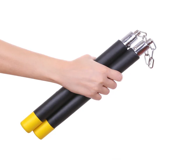 Ninja nunchucks in hands isolated on white Stock Picture