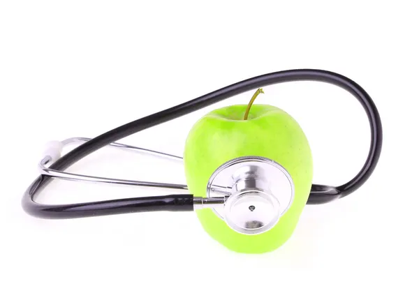 Stethoscope and green apple isolated on white — Stock Photo, Image