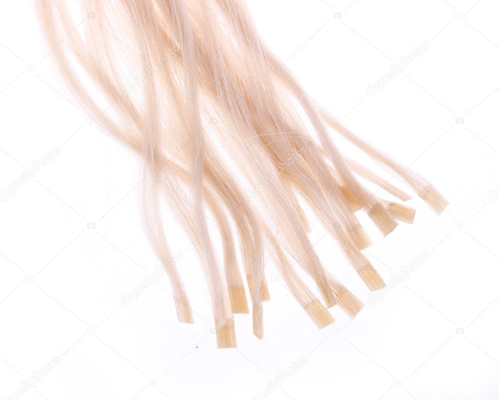 Keratin capsules of blonde hair extensions isolated on white