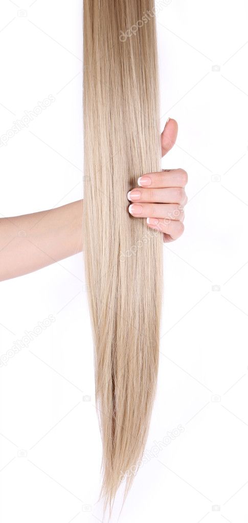 Blonde hair extensions in female hand isolated on white