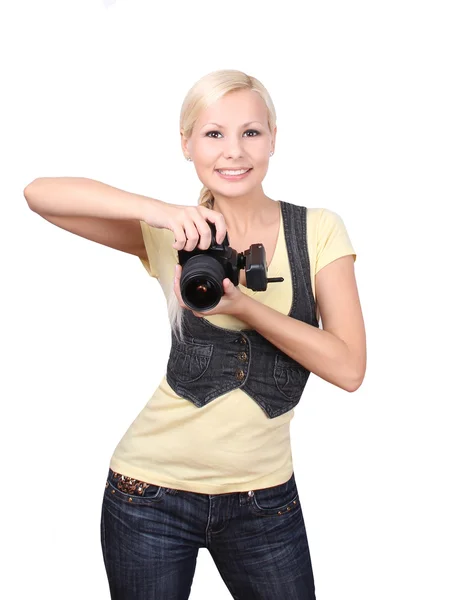 Chica joven con la cámara sonriendo aislado en blanco — Foto de Stock