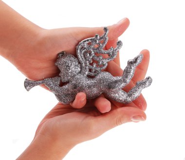 Glitter Noel meleği oyuncak üzerinde beyaz izole ellerinde