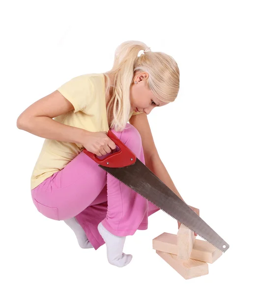 Blonde girl sawing wood boards isolated on white — Stock Photo, Image