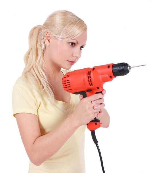 Blonde girl with goggles and drill, isolated on white