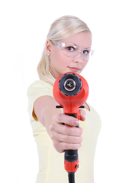 Blonde girl with goggles and drill, isolated on white — Stock Photo, Image