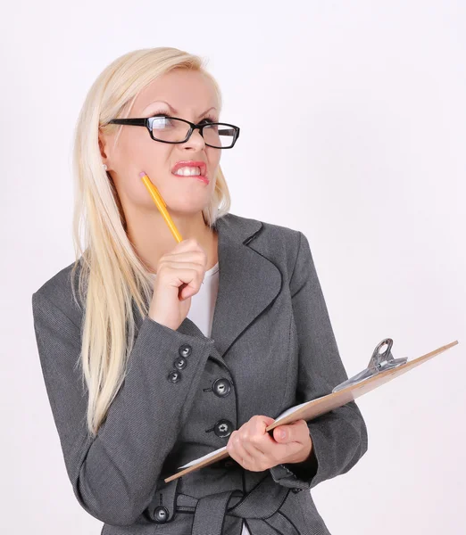 Portrait of angry secretary in glasses with pen and clipboard on white background — Stock Photo, Image