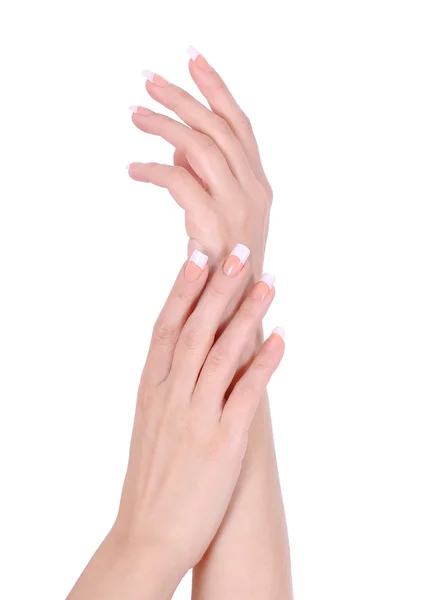 Hermosas manos femeninas con manicura francesa aislada sobre fondo blanco, cuidado de las manos — Foto de Stock