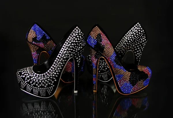 Crystals encrusted shoes collection on black background — Stock Photo, Image