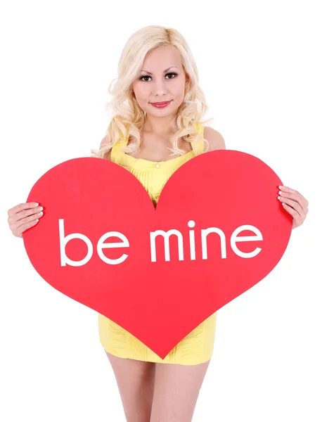 Blonde jonge vrouw met grote Valentijnskaart hart geïsoleerd op wit — Stockfoto