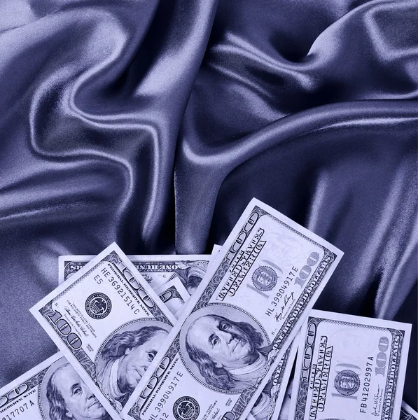Dollars bills on silk fabric, sexy money — Stock Photo, Image