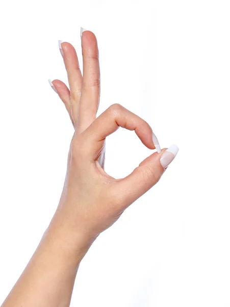 Mão em sinal ok em um fundo isolado branco — Fotografia de Stock