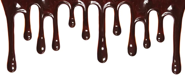 Fluxos de chocolate isolados sobre fundo branco — Fotografia de Stock