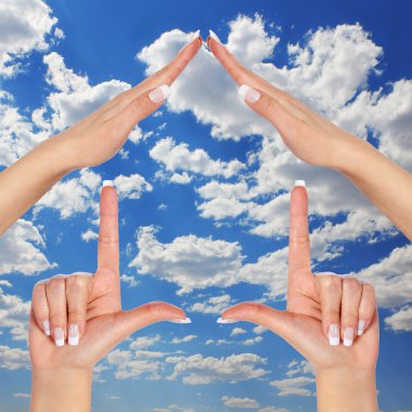 House made of female hands over blue sky with clouds. concept symbol home clipart