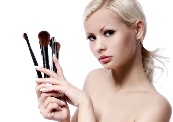 Beauty girl with makeup brushes isolated on white. beautiful blonde young woman — Stock Photo, Image