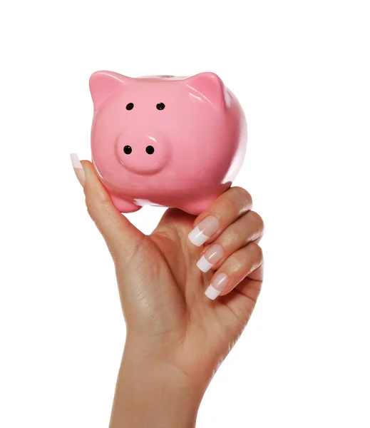 Piggy bank in vrouwelijke hand geïsoleerd op een witte achtergrond. besparingen — Stockfoto