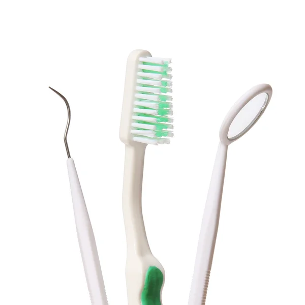 Стоматологічна допомога. Зубна щітка та стоматологічне дзеркало - дослідник ізольований на білому тлі. Стоматологічні інструменти — стокове фото