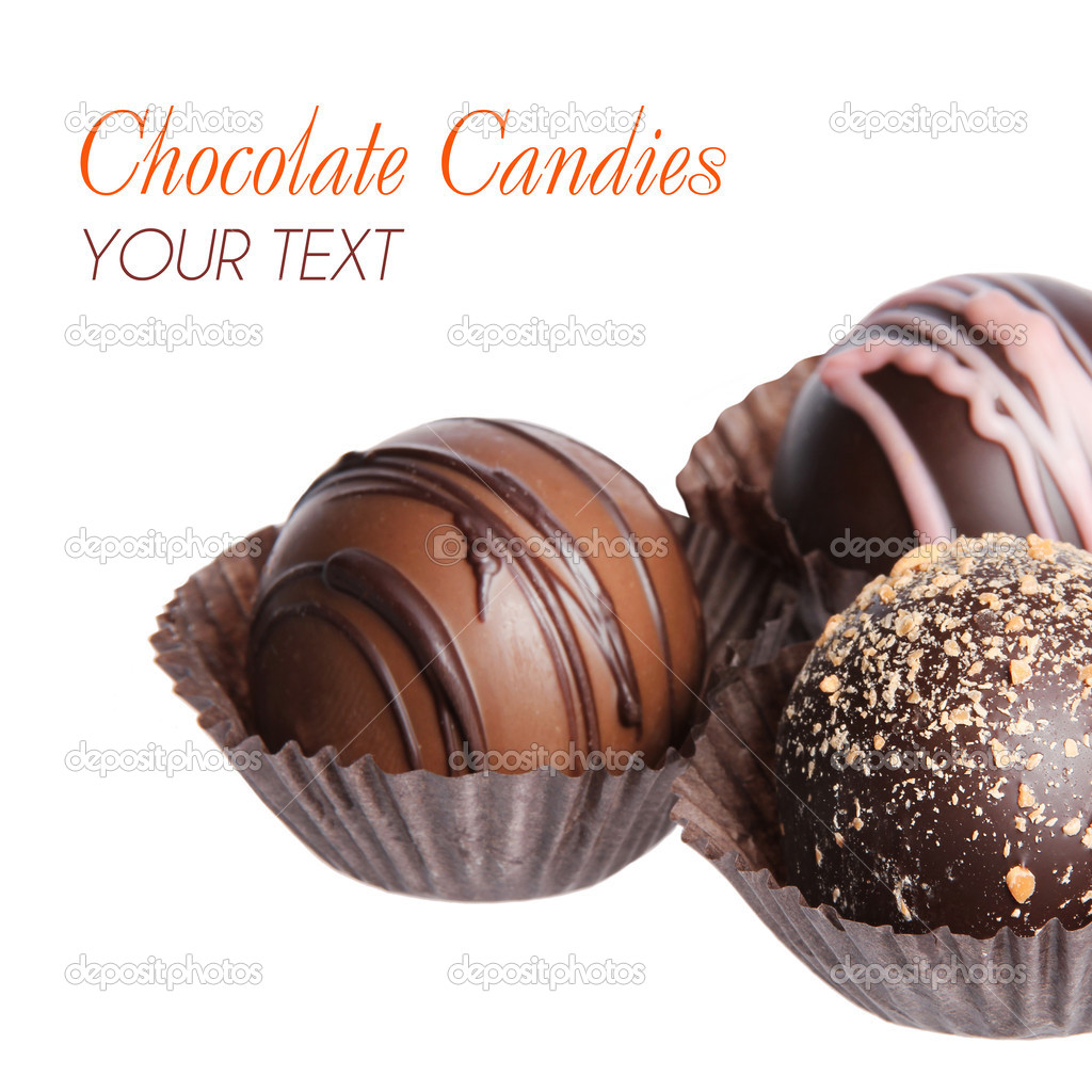 Chocolate candies. Collection of beautiful Belgian truffles in wrapper isolated on white background