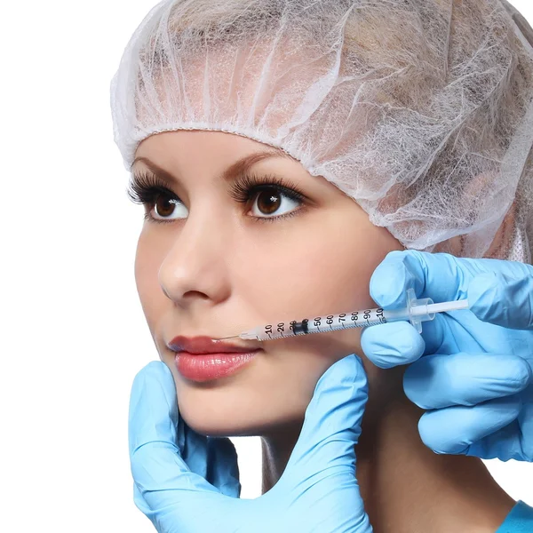 Botox injection in beautiful female face isolated on white. Lips zone. Closeup — Stock Photo, Image