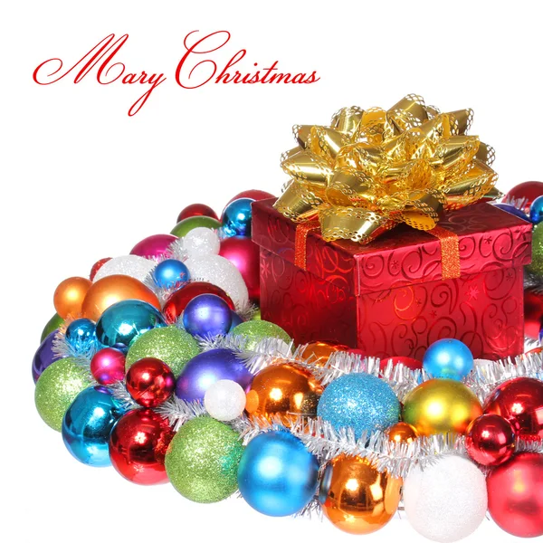 Christmas Gift with Gold Bow and Colorful Balls isolated on whit — Stock Photo, Image