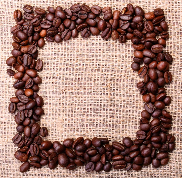 Coffee Beans, placed in shape of frame on burlap background — Stock Photo, Image