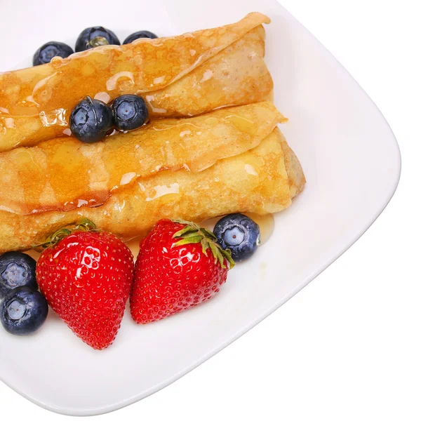 Crepes with Berries. Rolled Pancakes with Strawberry, Blueberry