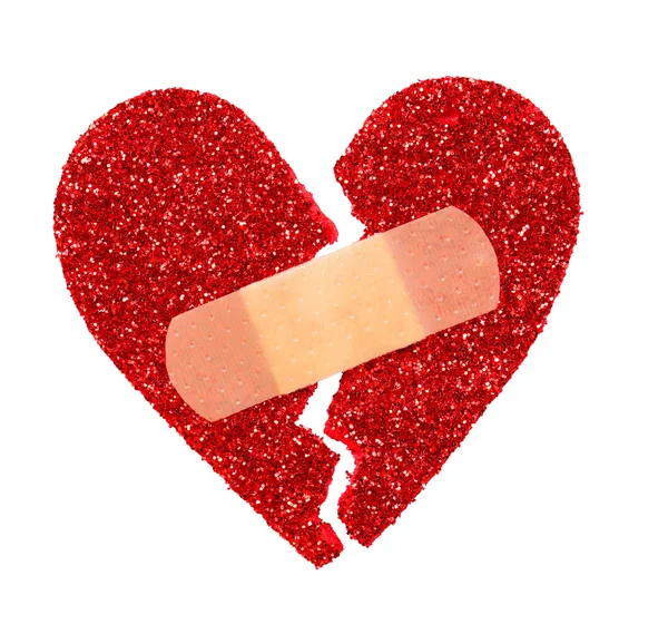 Broken Heart. Glitter ripped heart fixed with adhesive bandage — Stock Photo, Image
