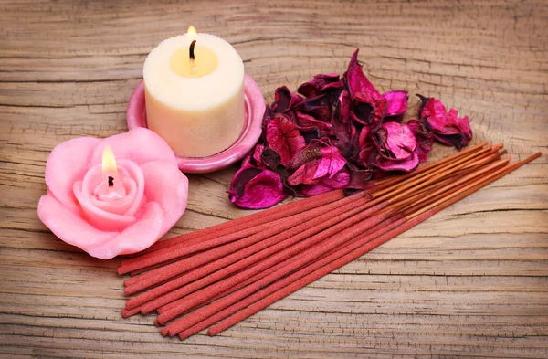 Spa Set. Burning candles with roses dried leaves and incense sti — Stock Photo, Image