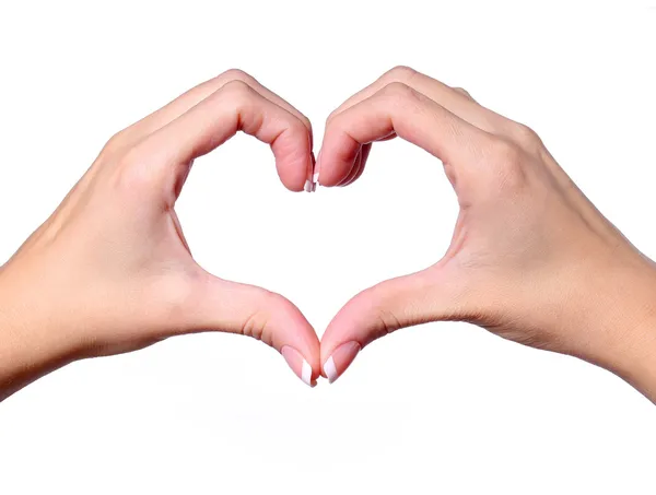 Manos femeninas haciendo una forma de corazón aislada sobre fondo blanco — Foto de Stock