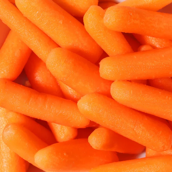 Carote fresche biologiche del bambino carote, sfondo — Foto Stock