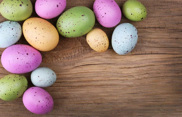 Colorful easter eggs on wooden background — Stock Photo, Image