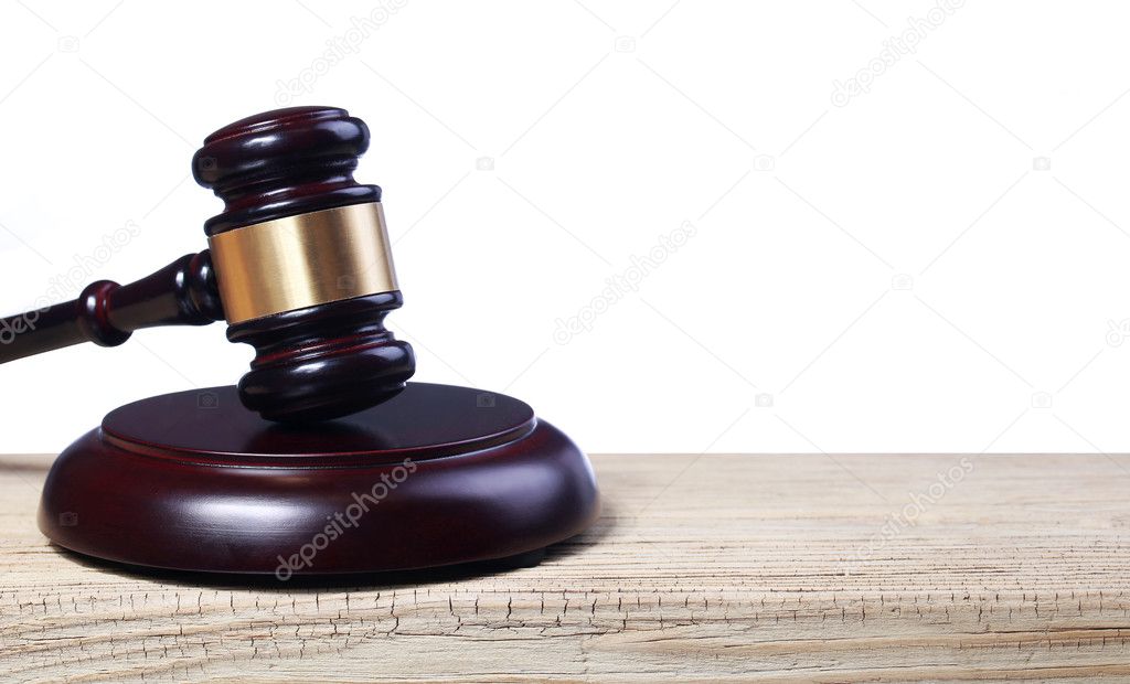 Judge gavel and soundboard on wooden table isolated on white