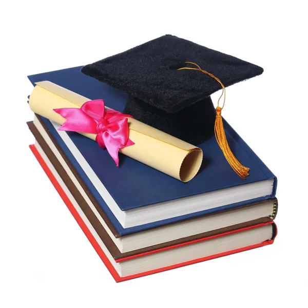 Black Graduation Cap with Degree on Books isolated on White Back — Stock Photo, Image