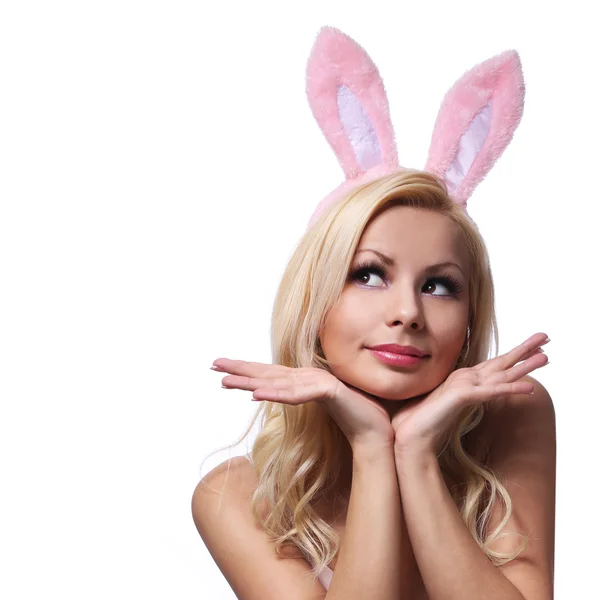 Sexy Frau mit Hasenohren. Playboy Blondine. Lächelndes Ostermädchen Stockbild