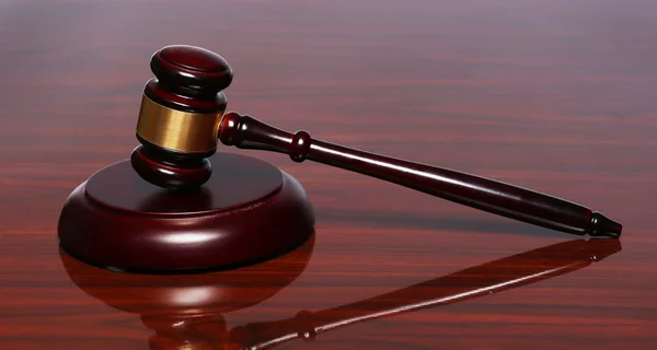 Judge gavel and sound board on the polished table — Stock Photo, Image