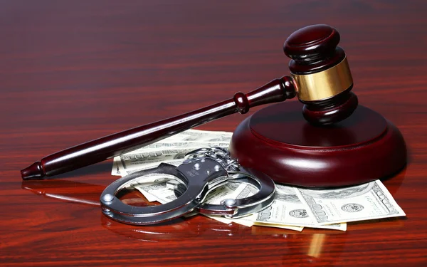 Judge Gavel and Handcuffs with Dollars Bills on the Table. — Stock Photo, Image